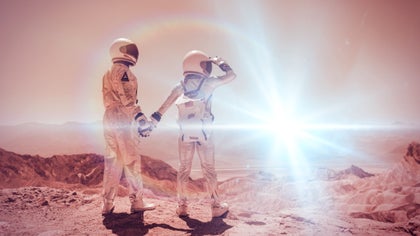 Two astronauts holding hands under a bright lens flare on a sci-fi landscape