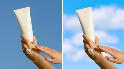 Hands holding lotion tube with background updated using sky replacer to add clouds