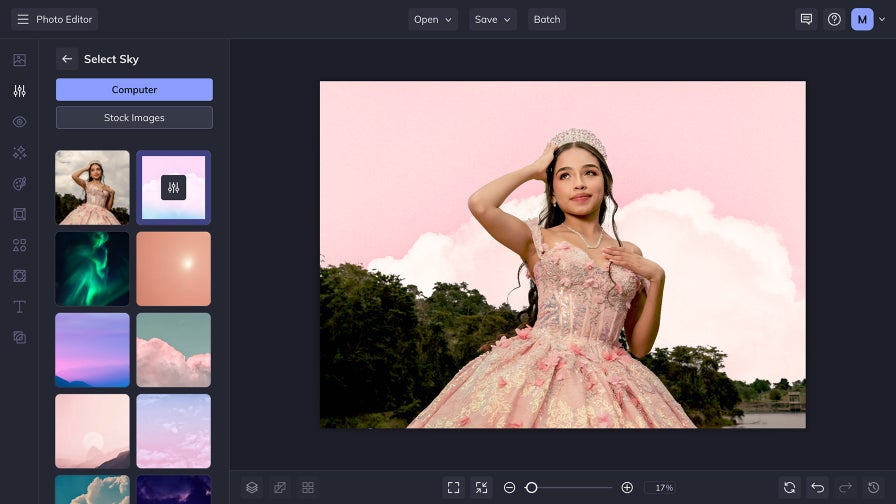 Girl in pink dress with sky replaced to soft clouds using AI sky replacer tool in photo editor
