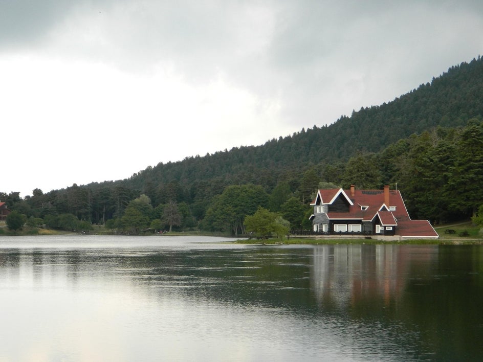 cloudy lakefront house with gloomy grey colors